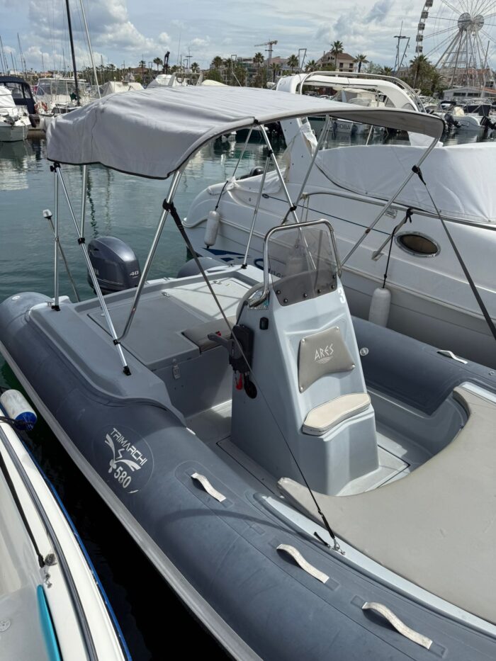 ARES TOURISM Trimarchi Boat anchored off Alghero beach